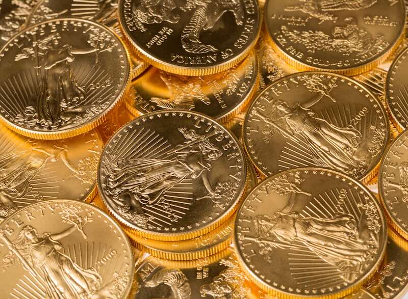 Stacks of gold eagle one troy ounce golden coins from US Treasury mint